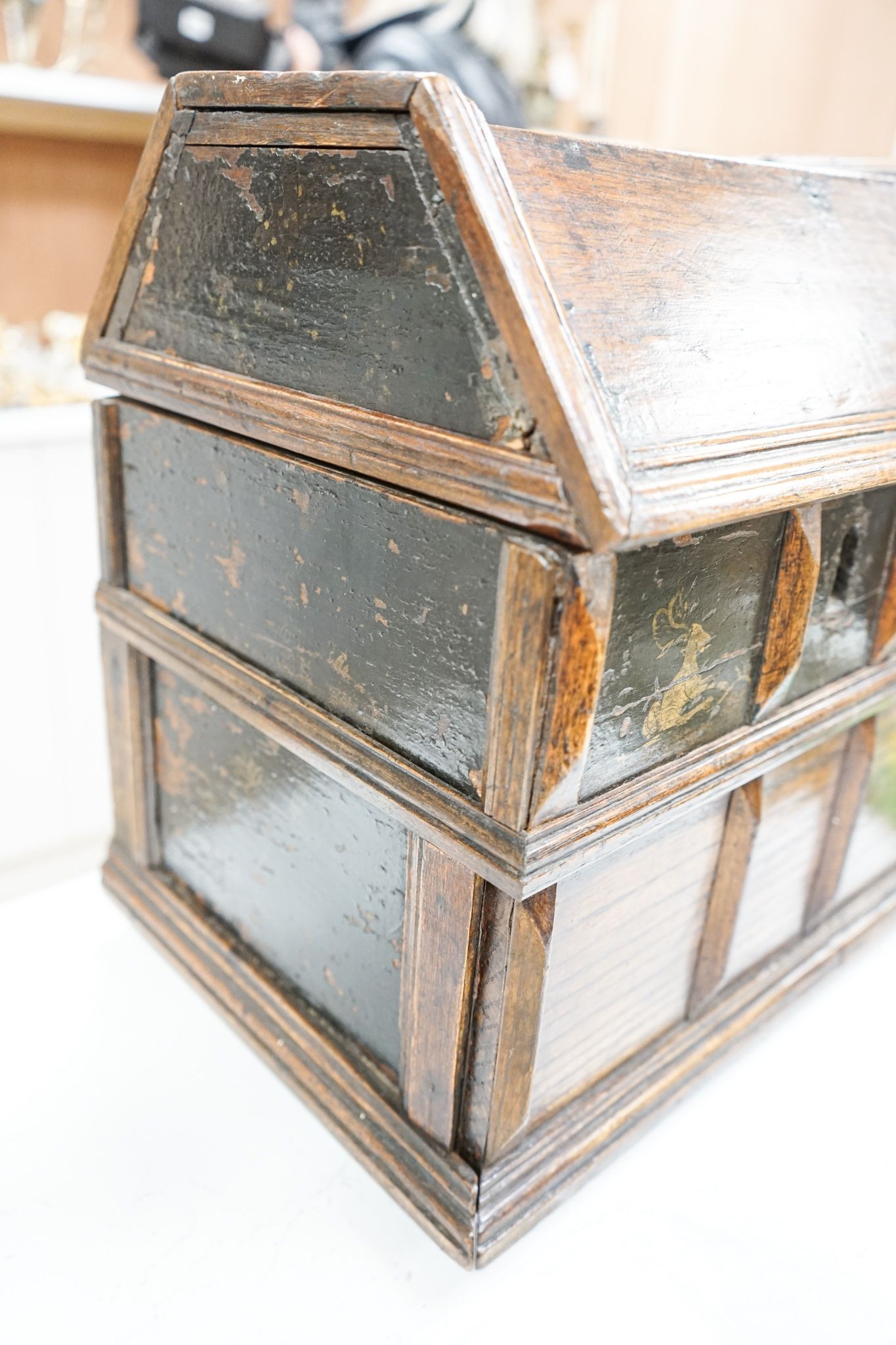 An unusual early 18th century Continental painted chestnut, oak and walnut table-top trunk with concealed drawers 38cm